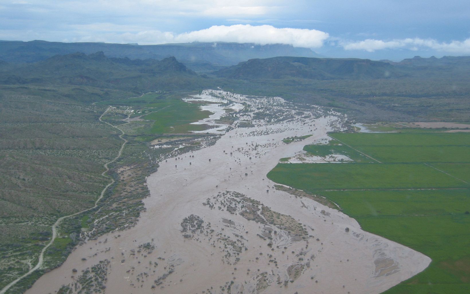 Aerial view of a wide, muddy river in Arizona.