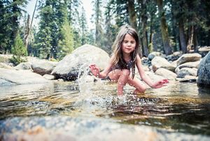 A child playing in the Marble Fork of the Kaweah River.