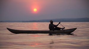 Fisherman in a dugout canoe.