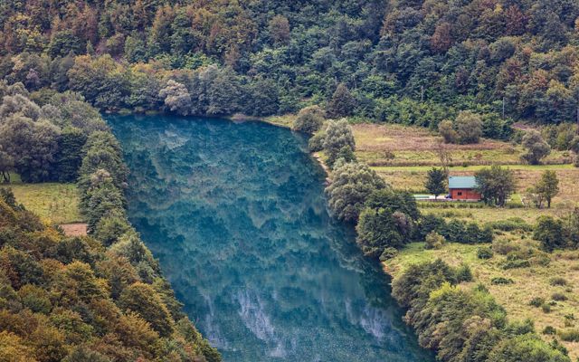 The Una River flowing through Bosnia. The river forms a natural border between Croatia and Bosnia-Herzegovina.