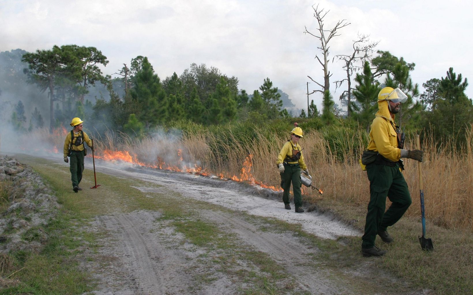 
                
                  On the Front Lines The Burn Crew monitors the fire ensuring safety first.  
                  © Eric Blackmore
                
              