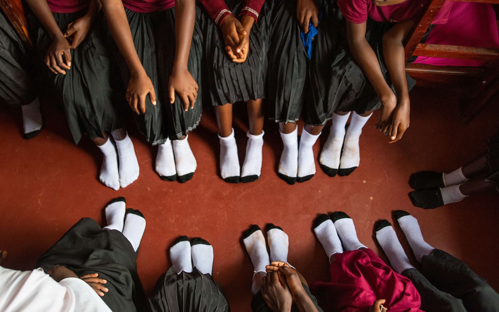 Happy Feet One of the benefits of the Lagosa Secondary School girls' dorm is the safety and friendship the girls have together.  © Roshni Lodhia