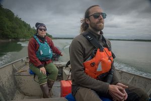 Mary and Bill pilot a motorboat through the Kvichak River. 