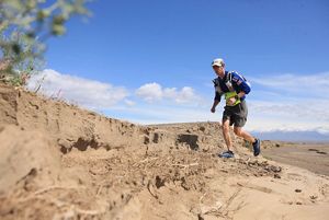 Kyle McCoy running in the desert.