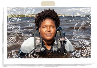 Dr. Tiara Moore with her head and shoulders above the ocean's surface.