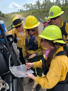 Women on the Firelines work together to strategize on the plan for a prescribed fire. 